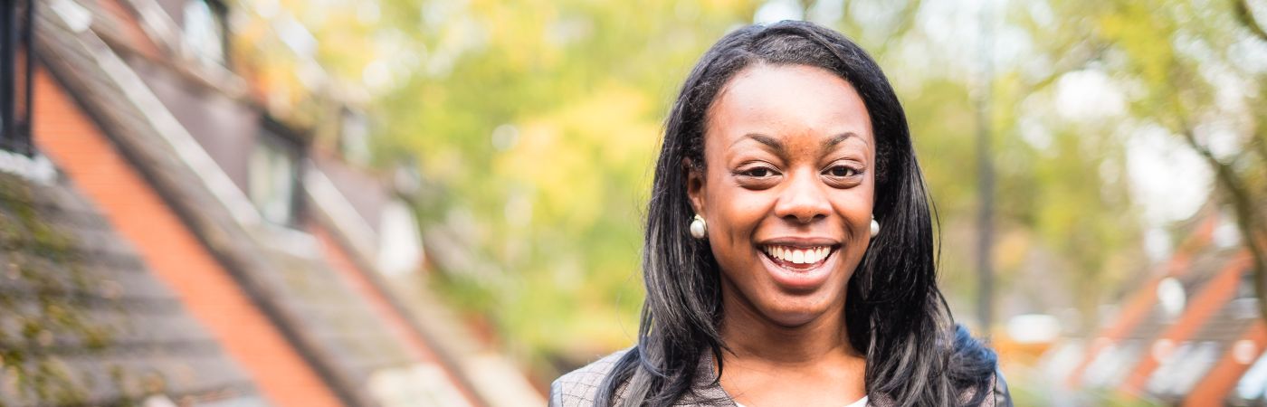 A student smiling outside Whitworth Park halls.