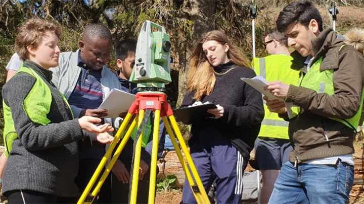 Students surveying on field trip.