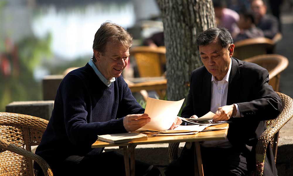 Talking to Frank Ching about his ancestors by the canal, Wuxi.