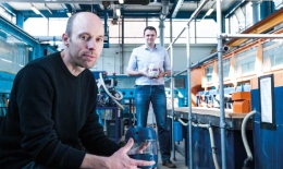 Scientists holding prototype 